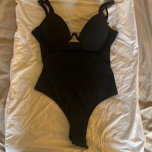 Size Small black V-shaped bodysuit.